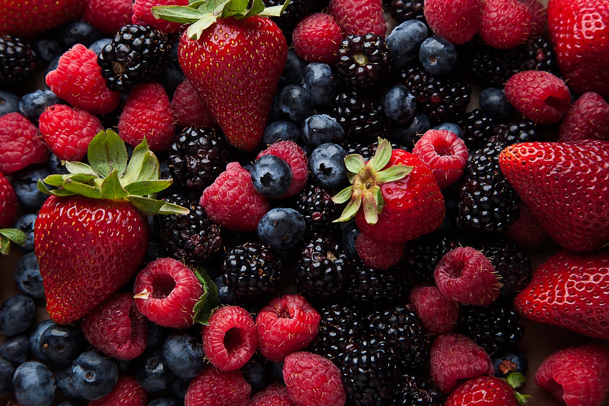 Fresh berry bowl with almonds and whole grain cereal